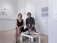 the painter leszek skurski and joanna skurska infornt of his artworks